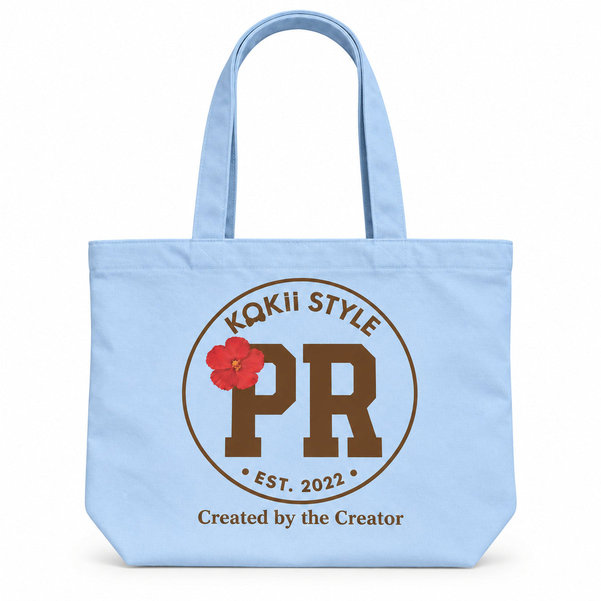 KOKii Style PR tote bag in Sky Blue with brown PR badge and red hibiscus