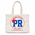 KOKii Style PR tote bag in Cream with blue PR badge, red ring and red hibiscus