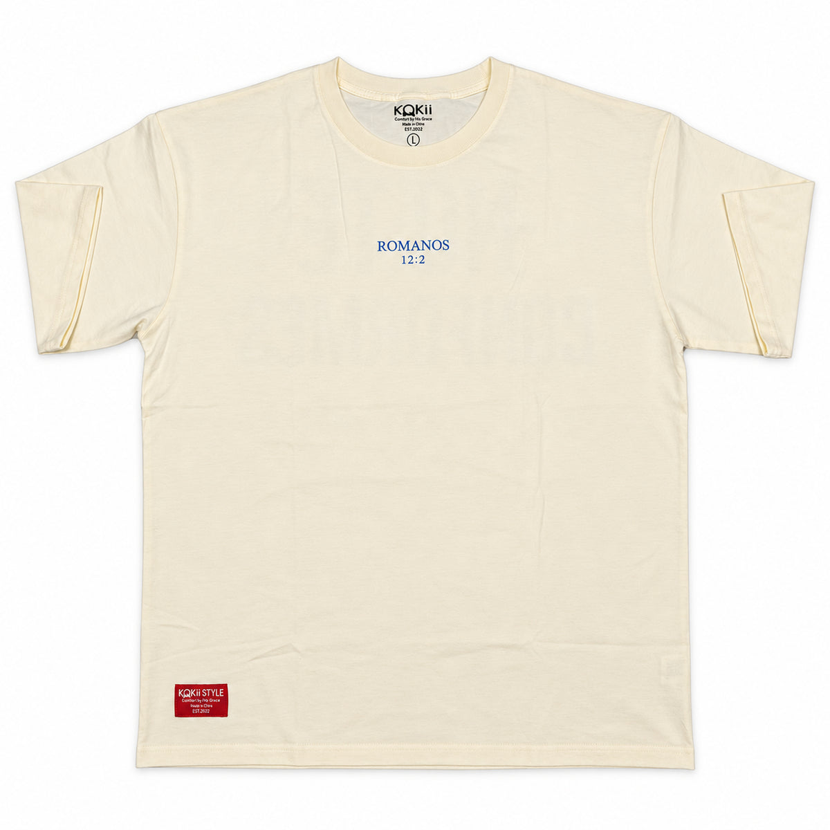 Romanos 12:2 No Te Conformes faith tee in cream by Kokii Style – front with blue Romanos 12:2 chest print