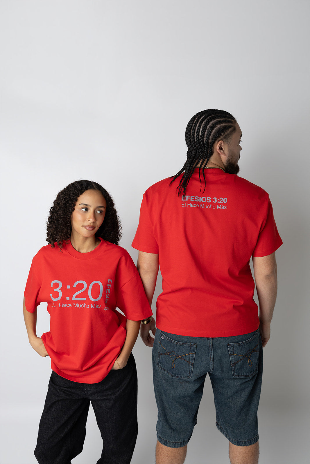 Couple wearing matching red Efesios 3:20 Christian tees by Kokii Style – front and back views
