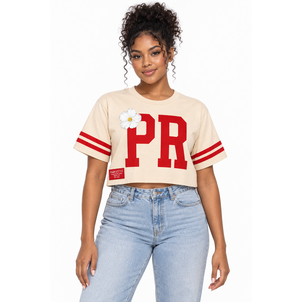 Woman wearing the Kokii Style PR Varsity Stripe Flor de Maga Crop Top in beige & red with light-wash high-waisted jeans – Puerto Rico streetwear
